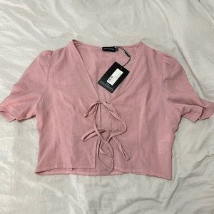PrettyLittleThing. Pink Gingham Tie Front Short Sleeve Crop Top
